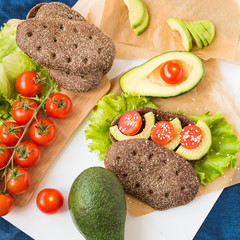Healthy food. Avocado Sandwich with Cherry Tomatoes and Lettuce