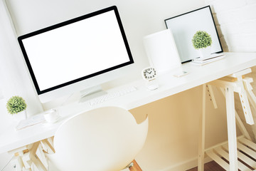 Designer desktop with empty computer screen