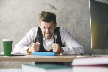 Crazy businessman eating book