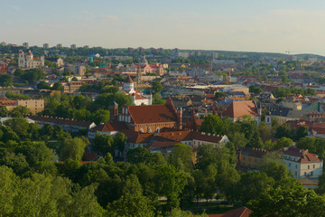 Fototapeta na wymiar Panorama of the city of Vilnius with many monuments, churches, castles and greenery. City listed as a UNESCO World Heritage site.