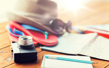 close up of camera, notepad and travel stuff