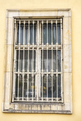 Fototapeta na wymiar Old barred window in Berlin, Germany