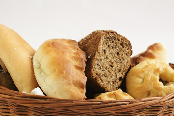 Bakery products in a wicker basket  close-up