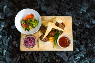 Barbecue. Fried shish kebab from pork meat. Fried chicken meat. Lamb on charcoal