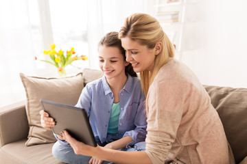 happy family with tablet pc at home