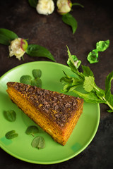 Cake with chocolate, honey and mint. Black background. Top view. Close-up