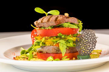 Grilled meat with vegetables served as a sandwich.
