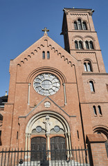 The facade of a neo-Gothic Catholic church in Poznan.