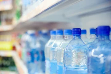 Schilderijen op glas  bottles of water at  store. © DariaTrofimova