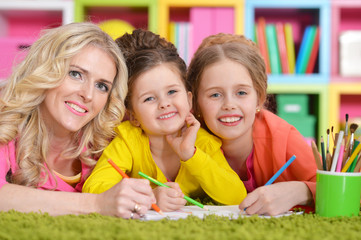 Mother with daughters drawing 