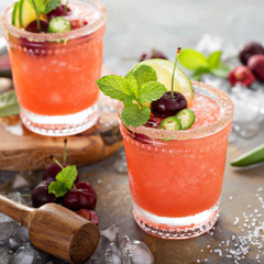 Refreshing summer cocktail with cherry