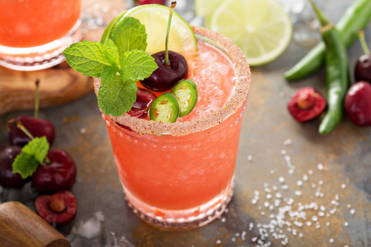 Refreshing summer cocktail with cherry