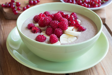 Summer breakfast - breakfast bowl with raspberries and currants