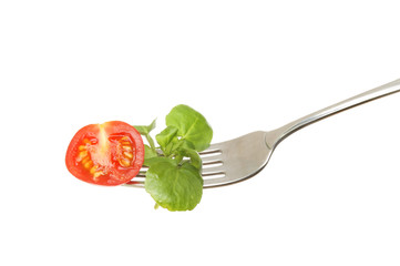 Tomato and watercress on a fork