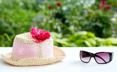 Sunglasses, flowers and beach hat