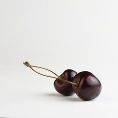 Two heart shaped cherry berries isolated on white background cutout