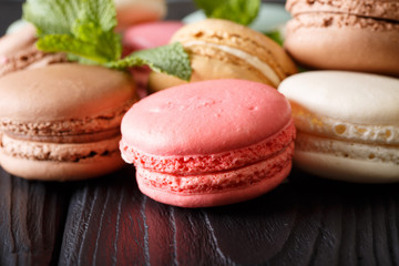 Background of colored macaroons in the assortment, macro. horizontal