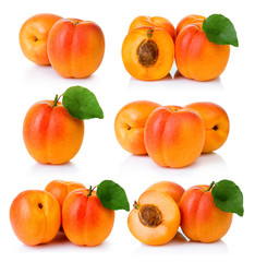 Set of ripe apricot fruits with with green leaf and slice isolated on white
