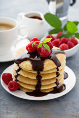 Stack of fluffy buttermilk pancakes with chocolate
