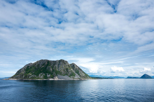 Godoy. Godoy is the southernmost and westernmost of the islands in the municipality of Giske, Norway. It is famous for its beautiful nature, dominated by the 497 meter tall mountain Storhornet.