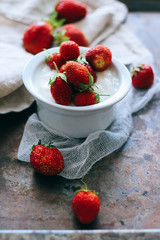 Natural yogurt with fresh strawberries, mint, metallic background