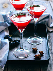 Red currant jelly in a glass. Drink in martini glass