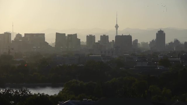 panoramic view of BeiJing BeiHai Park White Tower & metropolis high rise buildings urban.