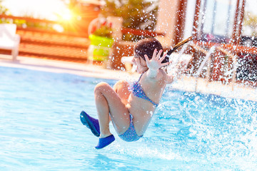 Joyful girl in the pool
