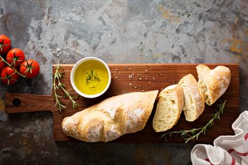 Fotobehang Homemade baguette with olive oil and salt © fahrwasser