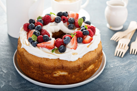 Angel food cake with whipped cream and berries