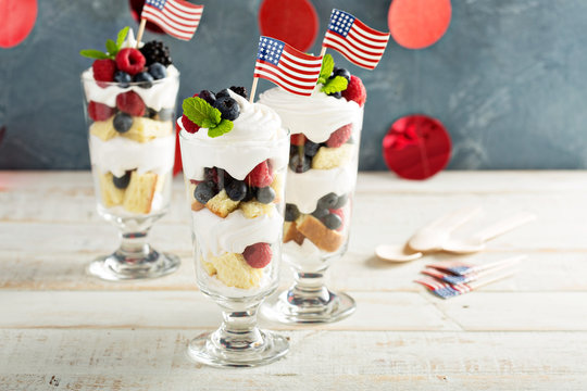 Layered dessert parfait with sweet bread and berries