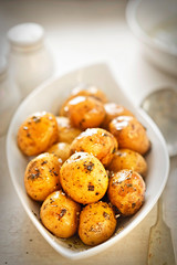 Baby jacket potatoes with herb and garlic oil dressing 