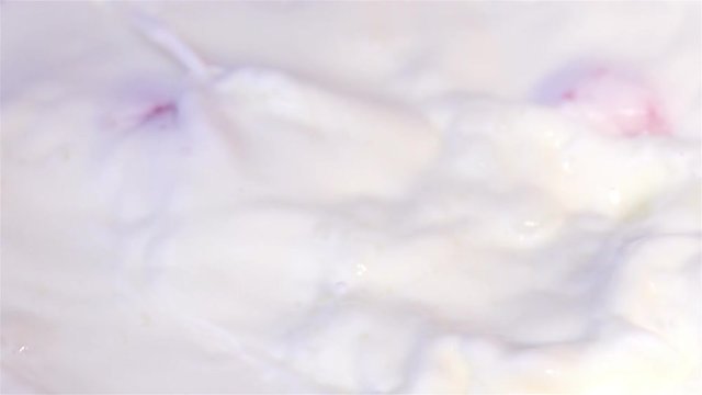 High quality video of strawberries falling into milk in real 1080p slow motion 250fps