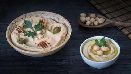 Hummus on a rustic wooden table