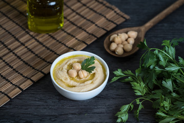 Hummus on a rustic wooden table