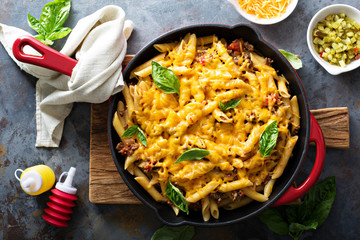 Cheesy pasta bake with ground beef and herbs
