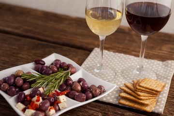 High angle view of olives served with wine