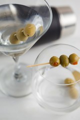 Close up of green olives in vodka martini 