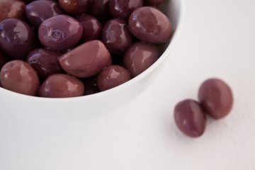 Cropped image of brown olives in bowl