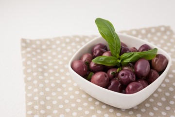 High angle view of brown olives with herb