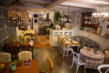 Interior of restaurant in country style. cozy restaurant in French style with empty frames for paintings and photographs on walls