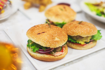 Decorated catering banquet table with different food appetizers assortment on a party

