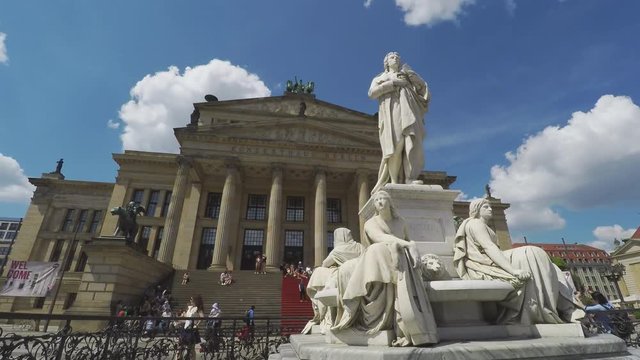 Time Lapse At Gendarmenmarkt In Berlin. Schiller Statue In Front Of Classical Concert Hall
