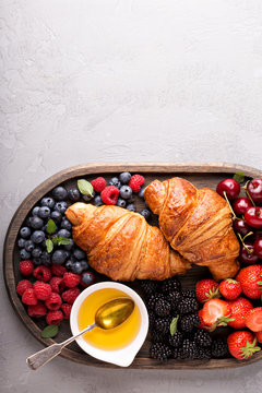 Healthy breakfast with freshly baked croissants and berries
