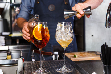 Barman at work, preparing cocktails. concept about service and beverages In the kitchen the restaurant