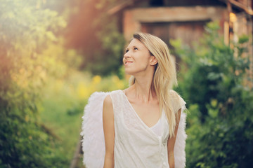 Naklejka premium Young beautiful woman with angel wings , fashion, dreaming, freedom concept