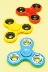 Fidget finger spinner stress, anxiety relief toy, vertical.
