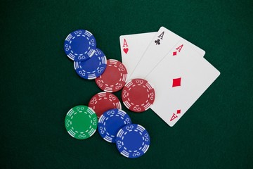 Playing cards and casino chips on poker table