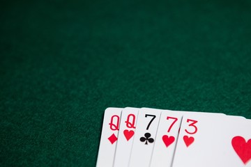 Playing cards arranged on poker table