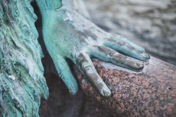 female hand closeup , bronze statue hand closeup
